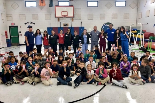 PDS members take part in a Dental Hygiene Visit with a second grade class at Aoy Elementary School (October 2018)